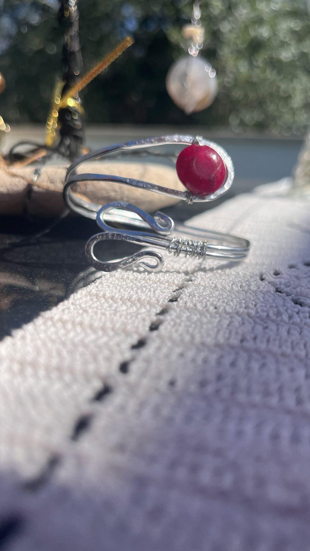 Arm bracelet with red stone