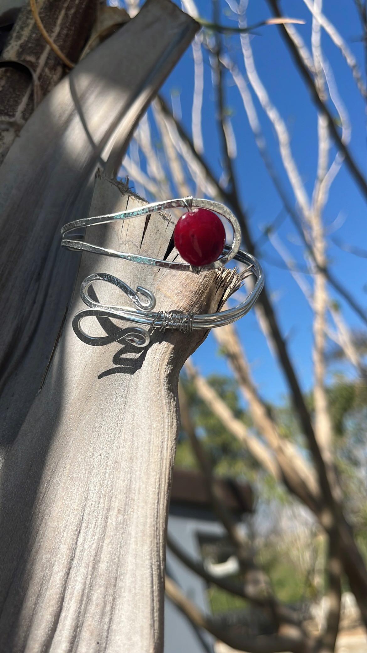 Arm bracelet with red stone
